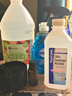 bottles of water, vinegar, and other ingredients on a table