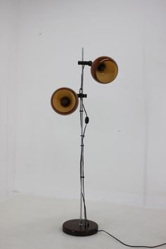 a floor lamp with two speakers on it