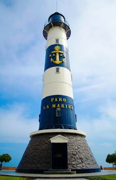 a large lighthouse with a blue and white top