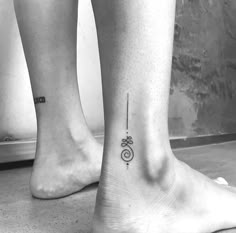 two people with small tattoos on their legs