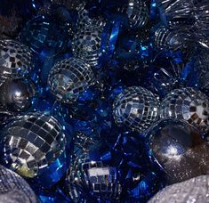 blue and silver disco balls are in a bowl