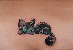 a black cat tattoo on the chest