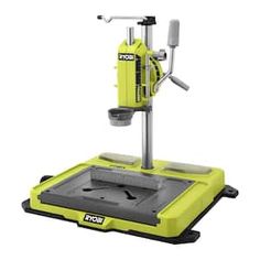 a machine that is sitting on top of a table with tools in the bottom half