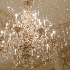 a chandelier hanging from the ceiling in a room