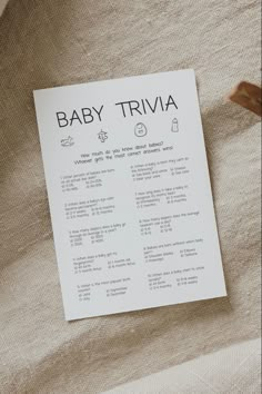 a baby trivia sitting on top of a bed