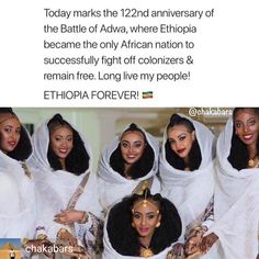 four women dressed in white are posing for the camera with their heads covered by veils