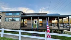 a house with an american flag in front of it