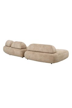 two beige couches sitting next to each other on top of a white flooring