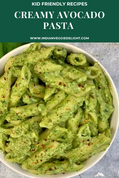 a bowl full of creamy avocado pasta with the title overlay above it