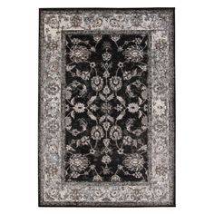 a black and white rug with an ornate design on the bottom, in front of a white background