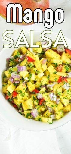 mango salsa in a white bowl with the words mango salsa on top and below it