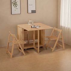 a small wooden table with two chairs next to it