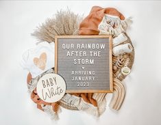 a sign that says our little rainbow baby shower