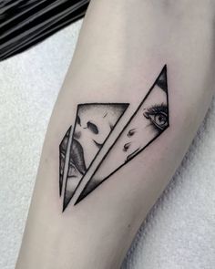 a black and white tattoo on the arm