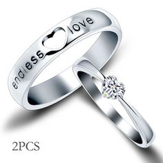 two wedding rings with the words i love you and an image of a heart on them