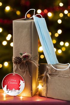 two wrapped presents sitting on top of a table