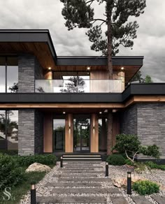 a modern house with stone steps leading up to the front door