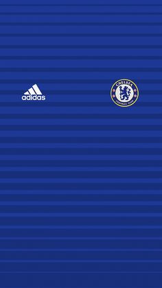 an image of a blue wall with the chelsea crest on it and adidas logo