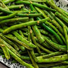 green beans with sesame seeds in a white bowl