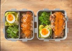 two plastic containers filled with food on top of a wooden table