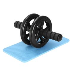 a pair of dumbbells on top of a blue mat