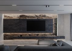 a large flat screen tv mounted to the side of a wall in a living room