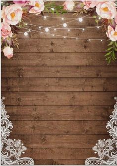 a wooden background with white lace and pink flowers on the bottom, surrounded by string lights