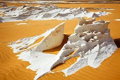 some white rocks and sand in the desert