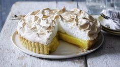 a lemon meringue pie on a white plate