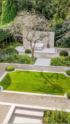 an aerial view of a garden with grass and trees