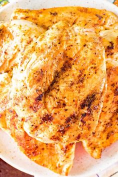 some chicken is sitting on a plate and ready to be cooked in the oven for dinner