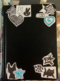 a black book with stickers on it