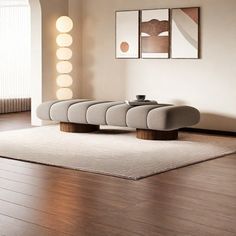 a modern living room with wood flooring and white walls