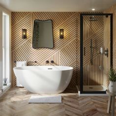 a bathroom with a large white bathtub next to a walk in shower