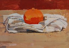 an orange sitting on top of a piece of cloth next to a red and white wall