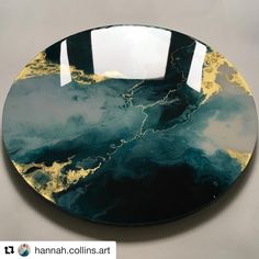 a black and gold plate sitting on top of a table