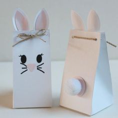 two paper bags with bunny ears on them