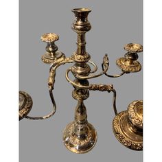 an antique brass candelabra with five candles