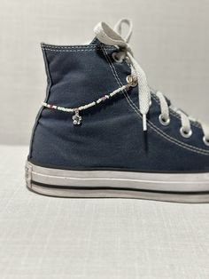 This shoe chain makes a great accessory for your outfit! You can even switch them out easily or use it as an anklet if desired! Item varies in length - around 8.5-9 inches in total. Seed Bead Shoe Chain, Beads For Shoes, Beaded Shoelaces, Shoe Charms Diy, Shoe Chains, Shoe Bracelet, Shoe Accessories Diy, Shoe Chain, Shoe Decorations