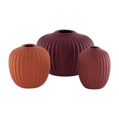 three vases in different colors on a white background