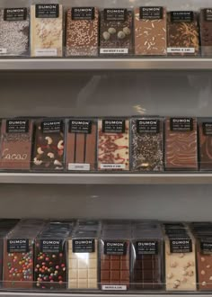 there are many different types of chocolates on the shelves