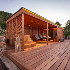 a wooden deck with a hot tub next to it