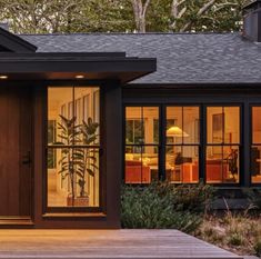 the front entrance to a modern home at night