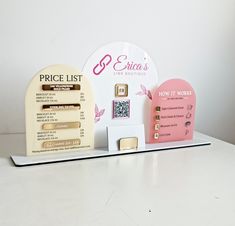 the price list is displayed in front of some magnets and brochure holders