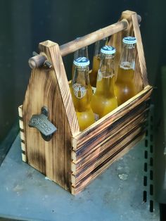 a wooden crate filled with bottles of beer