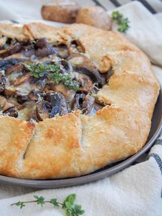 a mushroom and cheese pizza on a plate