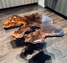 a wooden table sitting on top of a hard wood floor