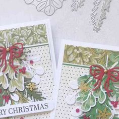 two christmas cards with bows on them