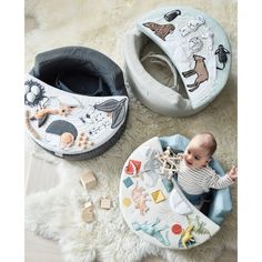 two baby bibs, one with animals and the other with toys