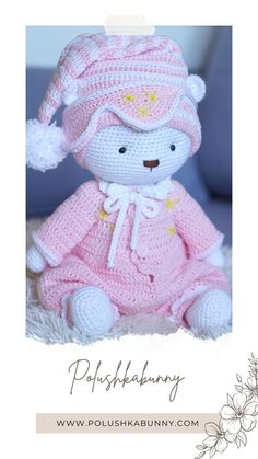 a crocheted teddy bear wearing a pink dress and hat